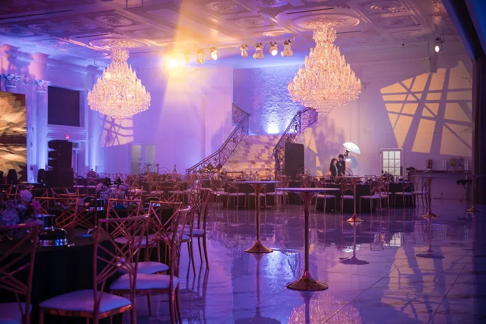 Crystal chandeliers and string-lit tables set for a private event at Whites Ferry Manor